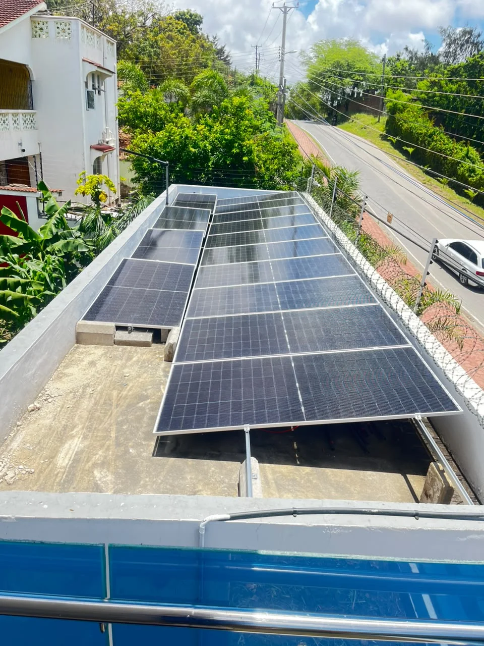 Completed monocrystalline rooftop solar array overlooking luxury villa in Milimani Nyali