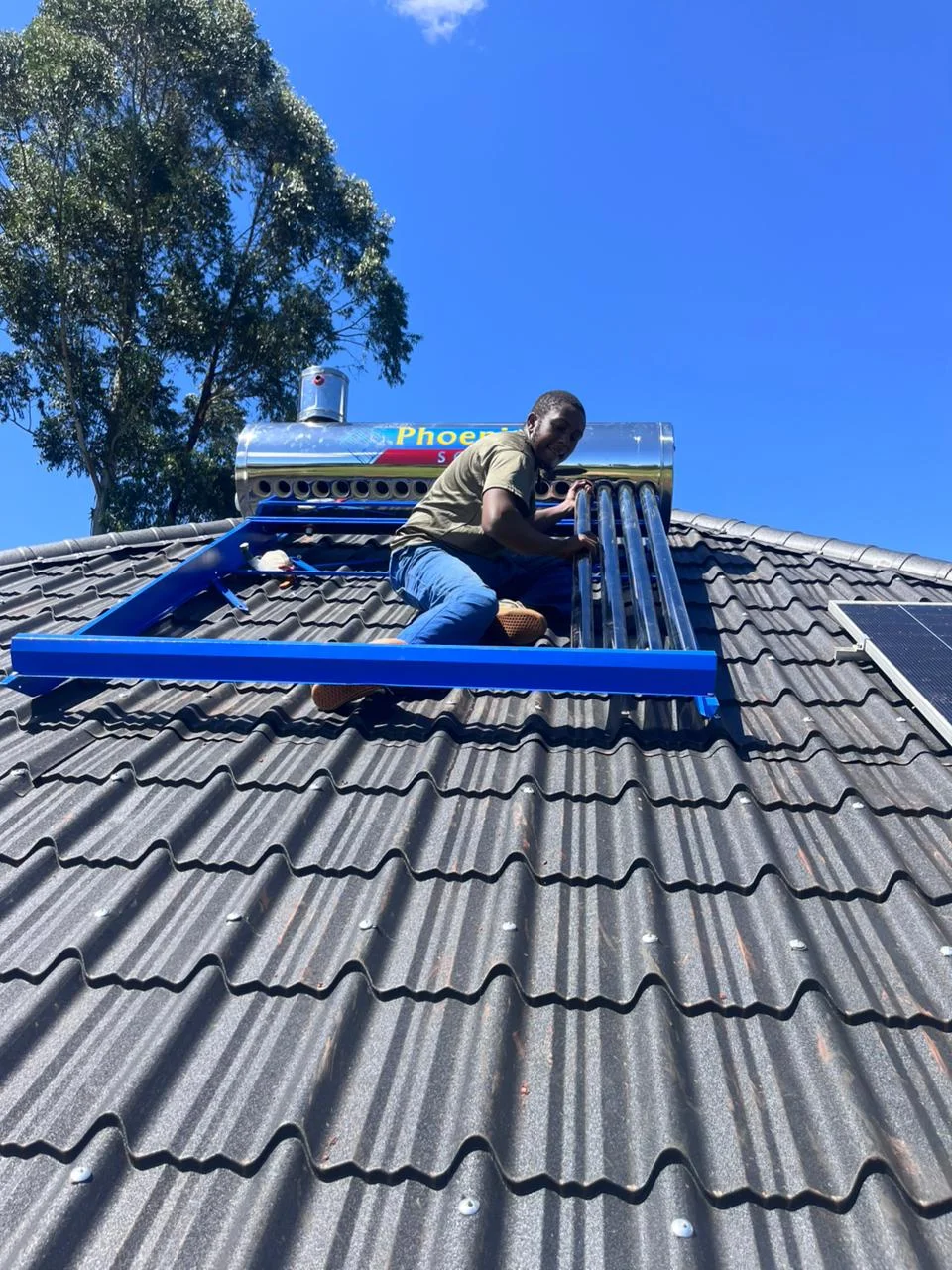 Rooftop solar water heater installation in progress